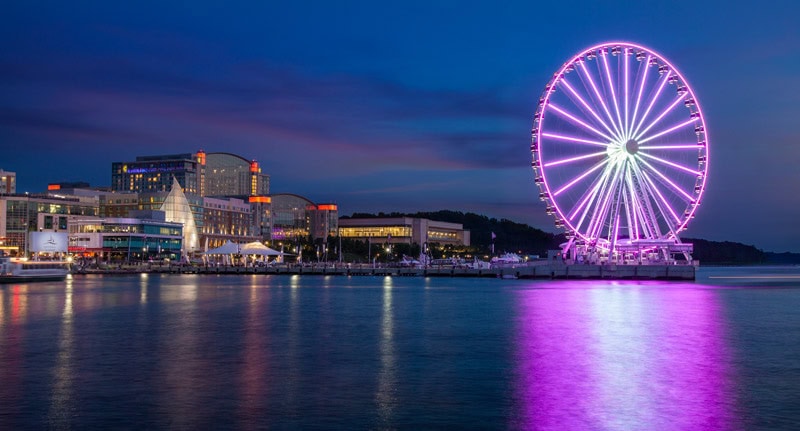 national harbor and capital wheel at night credit national harbor